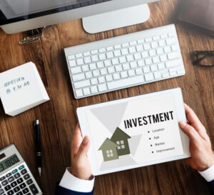 Should I sell my investment property - investor reviewing property investment factors