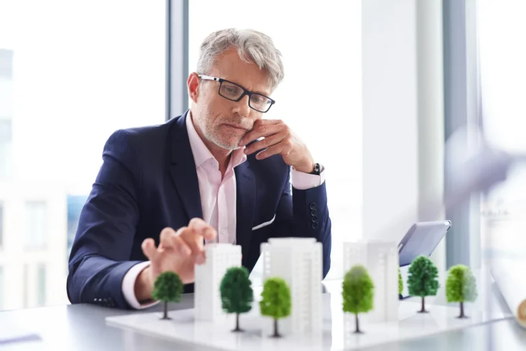 Landmark Property investor reviewing long-term property investment opportunities and residential development models in Queensland.
